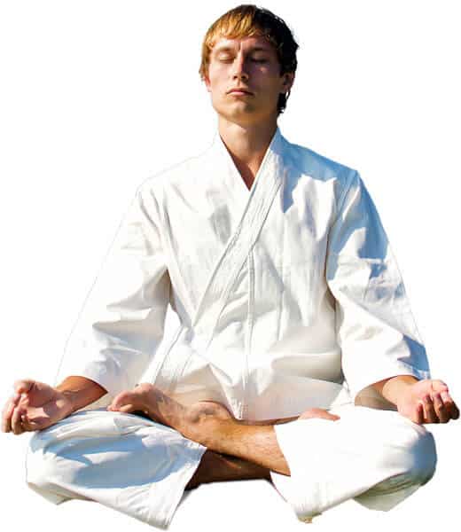 Martial Arts Lessons for Adults in MI MI - Young Man Thinking and Meditating in White