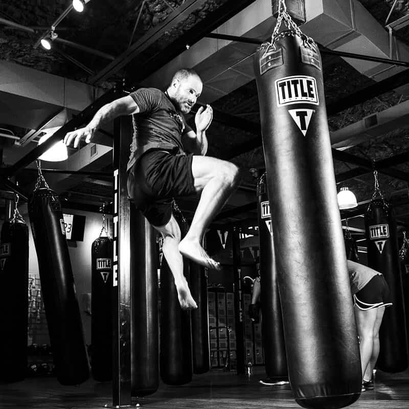 Mixed Martial Arts Lessons for Adults in MI MI - Flying Knee Black and White MMA